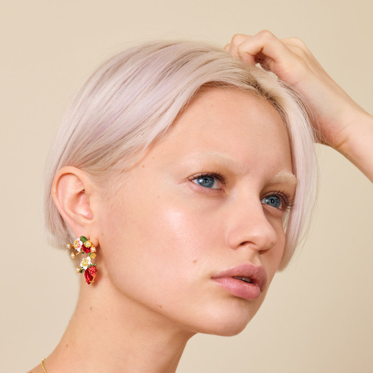 Post Earrings LE BOIS GOURMAND — worn by a model