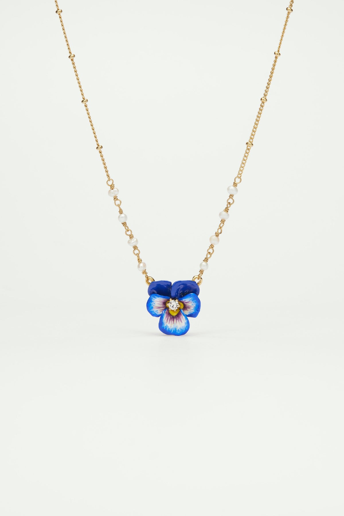 Blue pansy and faceted crystal pendant necklace