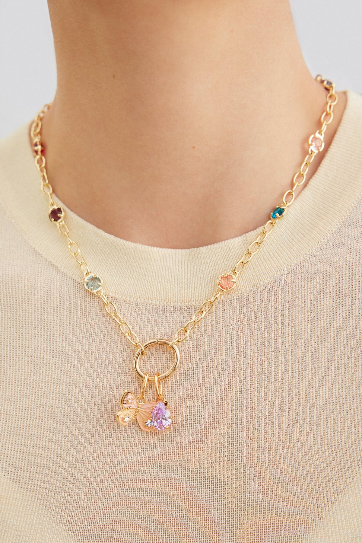 Pendant LES PENDENTIFS papillon — worn by a model